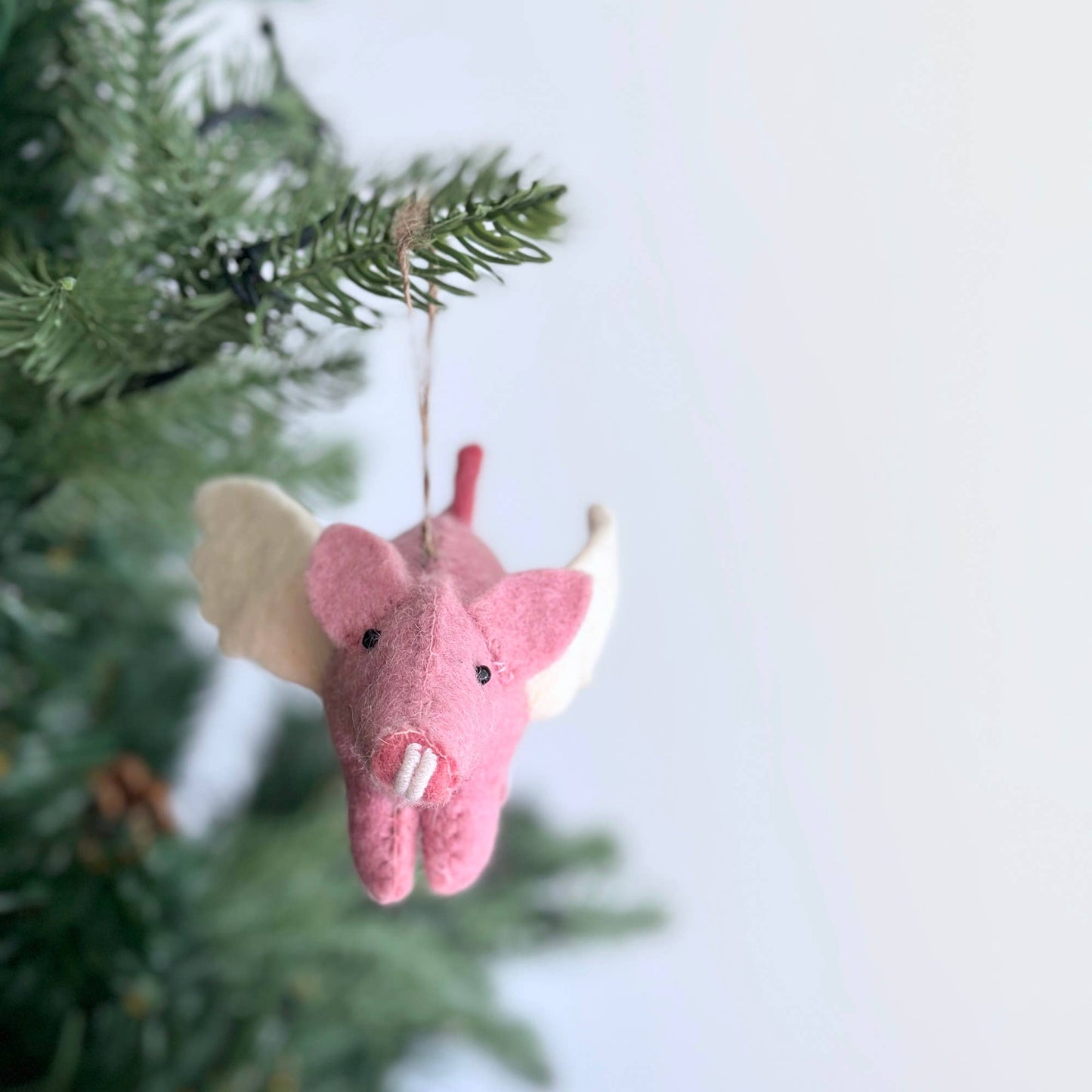 Felt flying pig ornament